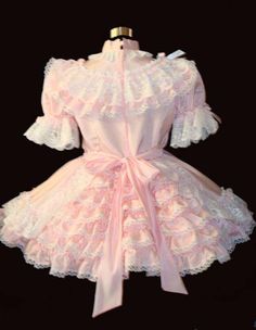 A girl's gown is shown in the image, and it is very pretty in light pink.