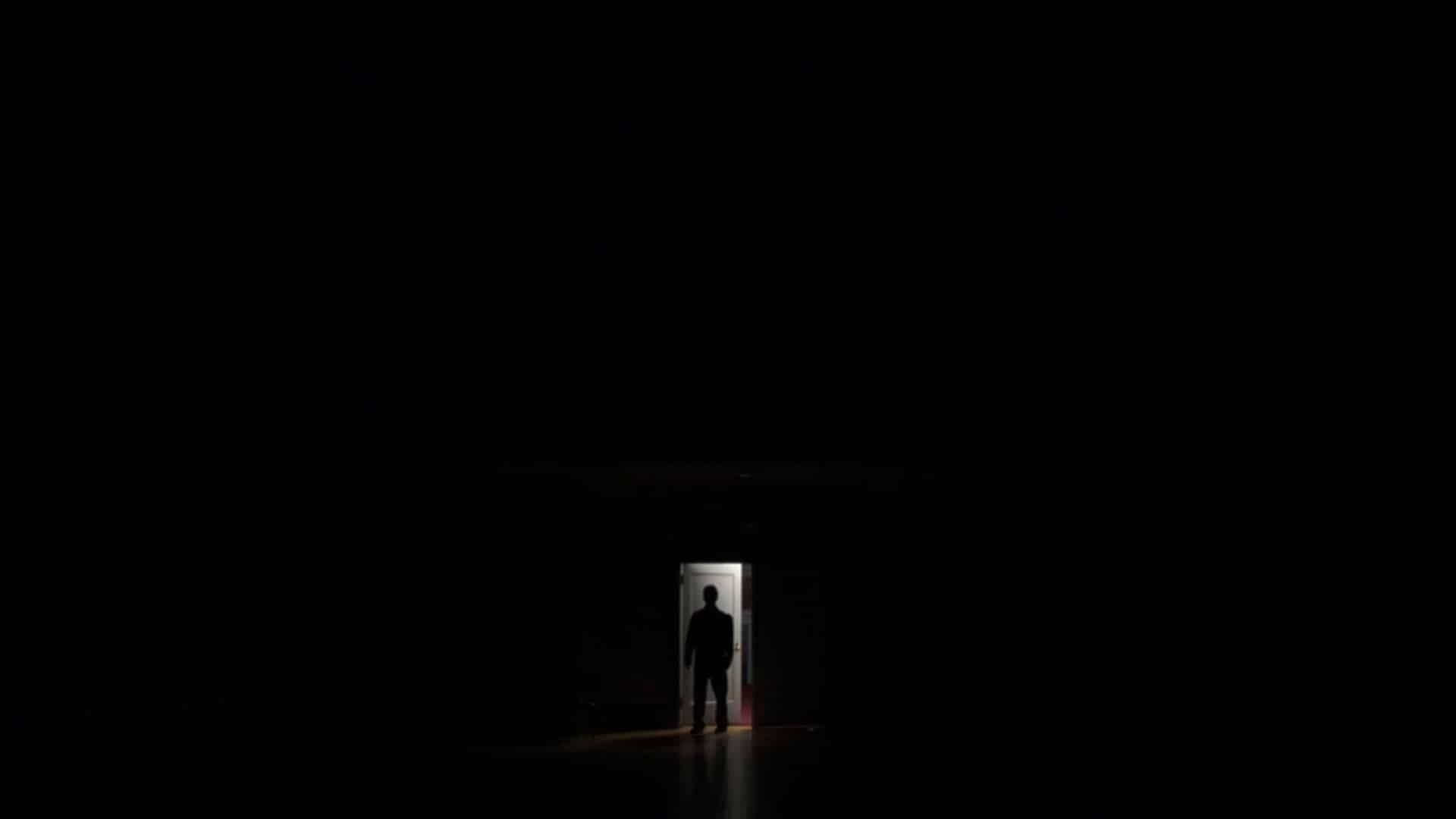 In this photograph, a Darkness can be seen, and a single boy is standing.