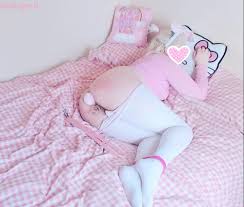 On the bed is a Hairy Pussy Lady, dressed in the white and pink ensemble.