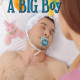 A man is saucing a baby nipple while in a naked position.