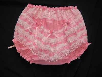 There is neither a ruffle nor a diaper sissy on the light pink ruffled panties.