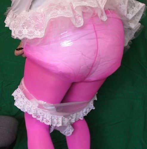 A Pink Butt man is posing for shots while standing on the ground and donnin...