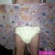 For the photo shoot, a Diaper Fetish man is posing while standing on the ground.