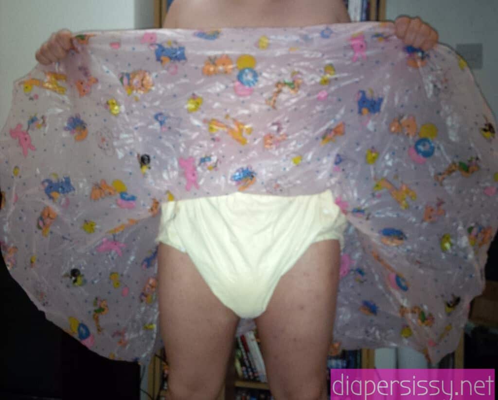 For the photo shoot, a Diaper Fetish man is posing while standing on the ground.